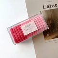 Detailansicht von rosa nahtlosen Haargummis in transparenter Box mit hoher Elastizität - Rosa (A-3303-4)