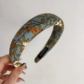 Detailed macro view of vintage floral satin headband with handmade label in blue grey - Blue-Grey Floral Style (C-1312-2)
