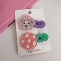 Detail of pink acrylic hair clips with bunny and floral patterns on white card - Pink Pentagon Rabbit & Floral Style (B-2800-5)
