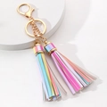 Colorful macaron leather tassel keychain with gold hardware and dual rings on a white base - Rainbow