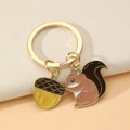 Cute cartoon squirrel and acorn alloy keychain with golden ring and enamel drip finish - Squirrel and Acorn Style