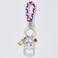 Detail of USA flag metal bottle opener keychain with woven red white and blue leather strap - Statue of Liberty USA Style