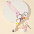 Close-up of pink multifunctional keychain set with cartoon lamb doll and nail clippers - Pink Sheep Theme