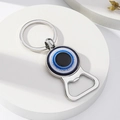 Silver metal Evil Eye bottle opener keychain on a clean white display stand - Style 3 (3)