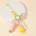 Multifunctional yellow duck keychain with pink nail clipper and silicone wrist strap - Yellow Duck Theme
