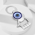Polished silver evil eye bottle opener keychain displayed on a white minimalist platform - Style 1 (1)