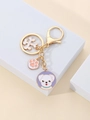 Detail of dog keychain with golden lobster clasp and colorful enamel pendants - Purple Background White Dog Style (4)