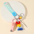 Pink cartoon bear nail clipper keychain with colorful rabbit charm and blue wrist strap - Blue Rabbit Theme