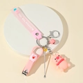 Roze varkentje sleutelhanger set met nagelknipper en siliconen band op display - Roze Varken Thema