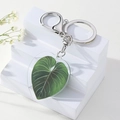 Herzförmiger Acryl-Schlüsselanhänger mit grünem Philodendron-Blattmuster und Karabinerhaken - Philodendron Grün Blatt Herz Stil
