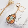 Portachiavi con teschio di toro e girasole stile western e anello dorato su base in pietra - Stile Bohemien Occidentale Teschio di Toro e Girasole (1)