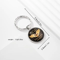 Detail of baby feet key ring with angel wings and memorial quote on glass dome - Mother Memorial Wings Style (Style 7)