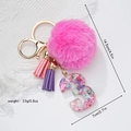 Detail of pink faux fur keychain with resin number 3 and leather tassels charms - Number 3 Style