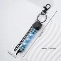 Dettaglio portachiavi con perline con dimensioni 17cm x 3,5cm e peso di 23g mostrato - Blu