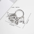 Close-up of car tool keychain with silver hammer and screwdriver charms engraved with dad - Sedan Style / Silver