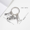 Detail of silver tool keychain with dad heart charm and miniature hammer wrench screwdriver - Taxi Style / Silver