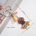 Detailed macro view of custom sunflower acrylic dog keychain with yellow tassel - Golden Retriever Sunflower Design (Style 8)