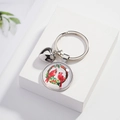 Silver alloy cardinal bird keychain with polished heart pendant on a clean white display - Two Cardinals in Wreath Festive Style (02)