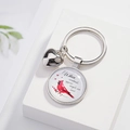 Silver cardinal bird keychain with heart charm and memorial message on white marble surface - Cardinal Angel Message Style (04)
