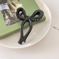 Grande molletta per capelli con fiocco nero lucido dal design minimalista chic - Nero