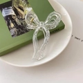 Elegant clear bow hair claw clip with transparent acrylic finish and silver metal spring - Clear