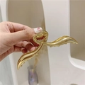 Polished gold metal wave hair claw clip featuring heart hinge for women - Gold