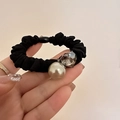 Elegant black scrunchie with large faux pearl and heart crystal detail in a hand-held view - Heart Bead Style (D-4868-2爱心)