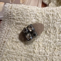 Detailed close-up of retro oval duckbill hair clip with grey rhinestones and woven texture - Coffee (D-4978-1)