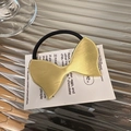 Eleganter Haargummi mit goldener Metallschleife und schwarzem elastischem Band für Damen - Goldene Schleife