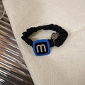 Macro view of black fabric scrunchie with blue crystal square and golden pendant - Black With Blue Block (D-5009-4)