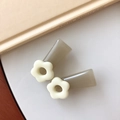 Close-up of gray translucent floral resin hair clips in a stylish cream and brown palette - Gray Brown Hollow Flower Style