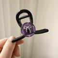 Pinza de pelo negra minimalista con centro de resina violeta y lazo metálico plateado - Morado