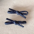 Close-up of deep blue denim fabric bow hair clips with twill texture and silver metal base - Small / Dark Blue