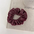 Detail shot of oversized burgundy faux leather scrunchie with soft pleated texture - Burgundy