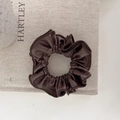 Premium deep brown leather scrunchie with neat stitching on a soft background - Brown