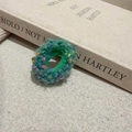 Detailed macro view of a green hand-knitted plush elastic hair tie with colorful dots - Green Polka Dot Plush Style (D-5637-3)