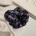 Detail of satin floral scrunchie with soft purple flowers on smooth black fabric - Black Light Pink (D-5640-1)