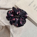 Floral black satin scrunchie with pink roses and bows on a cozy knit fabric background - Black Rose Pink (D-5640-2)