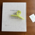 Minimalist light green frosted acrylic shark hair claw clip on a vintage book - Yellow