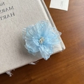 Blue organza flower hair clip for girls featuring multilayered petals and white stamens - Blue