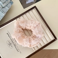 Sweet pink scrunchie with feather fringe detail and soft ruffled fabric texture - Pink