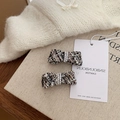 Elegant tweed bow hair clips with white faux pearl embellishments in a two-piece set - Black