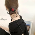 Elegant burgundy rose hair scrunchie with long black ribbons on a low bun hairstyle - Burgundy