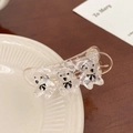 Close-up of a clear acrylic claw clip with three cute teddy bears and black bows - Transparent Snap Clip (J-125-4)