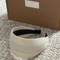 Detailed close-up of wide cream knitted headband with vertical ribbed texture and anti-slip lining - 6cm / White