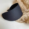 Detail view of the black ribbed fabric texture on a wide minimalist non-slip headband - 6cm / Black