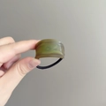 Elastic hair tie featuring a green marble pattern acrylic cylinder decorative bead - Green