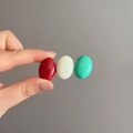Detail of candy-colored hair clip with red, white, and mint green resin ovals in hand - Red White and Mint Green Candy Color(D-5245-3)