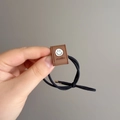 Elastic hair tie with brown acrylic square bead featuring a black smiley face and smile text - Coffee (D-5855-2)