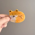 Close-up of orange marble acetate fox hair claw clip held by hand for size scale - Orange Fox Style (D-5883-1)